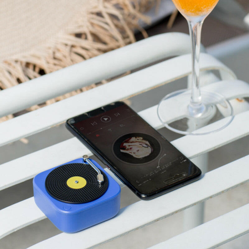 portable bluetooth speaker next to a cellphone