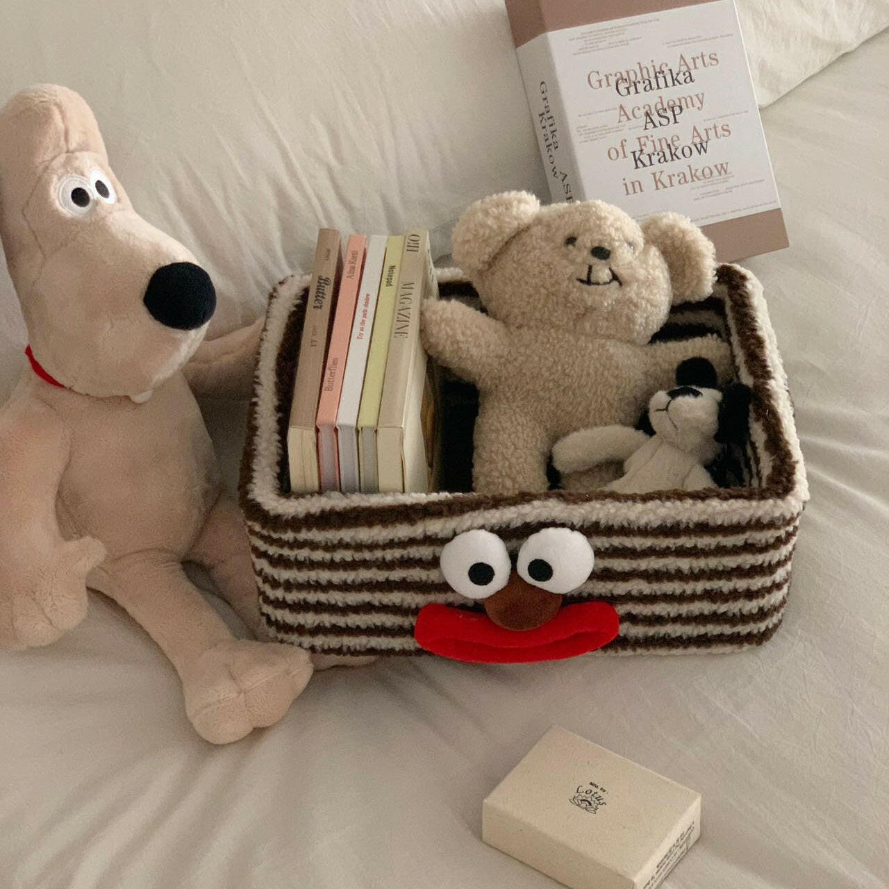Plush Clown Organizer Drawer with books and toys in it